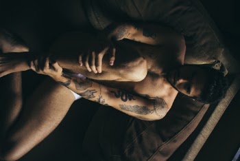 Man Sitting on Couchc