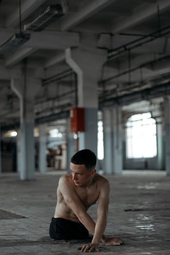 Man Sitting on Floor