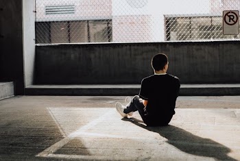 man sitting on floor