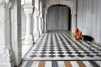 Man Sitting On Floor