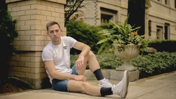 Man Sitting on Floor