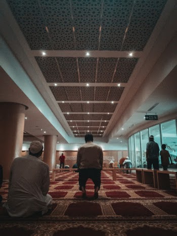 Man Sitting on Floor Inside Room