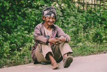 Man Sitting On Ground