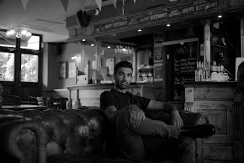 Man Sitting on Leather Sofa