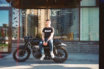 Man Sitting On Motorcycle