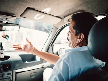 Man Sitting on Passenger Seat