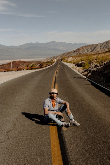 Man Sitting on Road