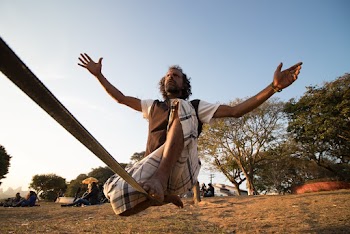 Man Sitting on Rope
