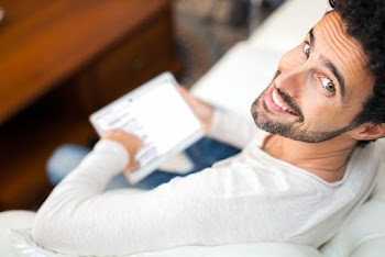 Man Sitting on Sofa