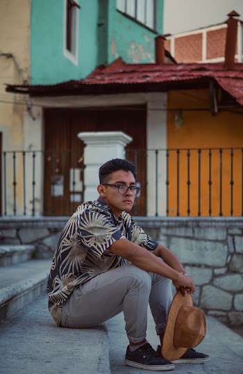 Man Sitting on Staircase