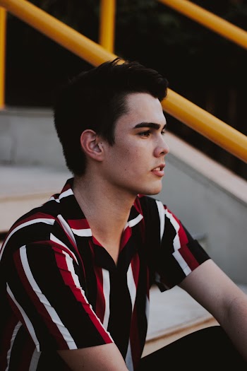 Man Sitting on Stairs