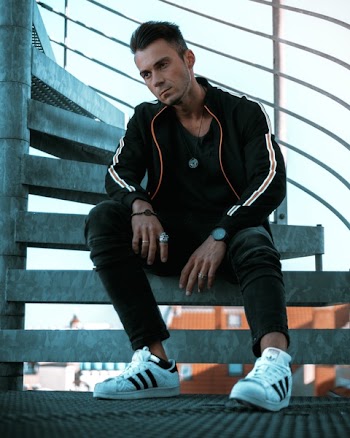 Man Sitting on Stairs