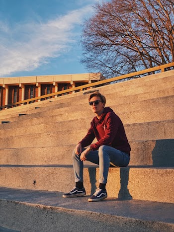 Man Sitting on Stairs