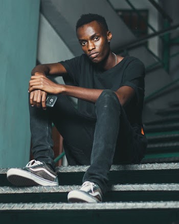 Man Sitting On Stairs
