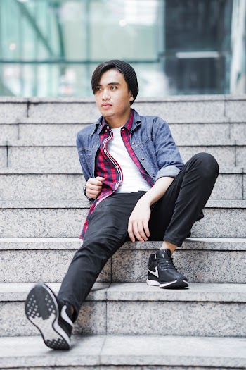 Man Sitting on Stairway