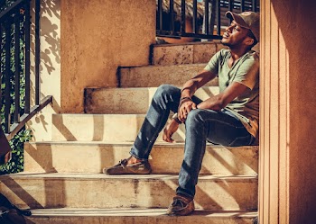 Man Sitting on Stairway