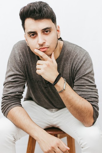 Man Sitting on Stool