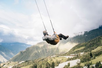 man sitting on swing