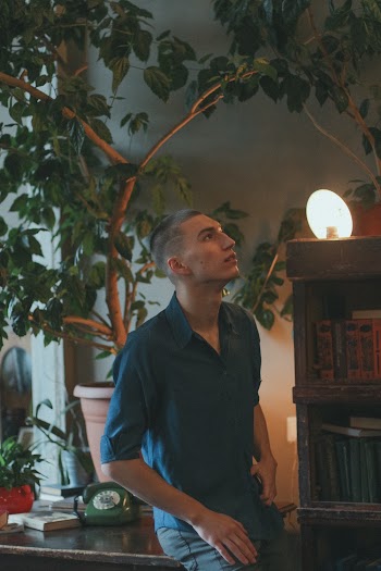 Man Sitting on Table