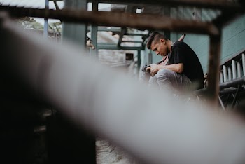 Man Sitting on Table