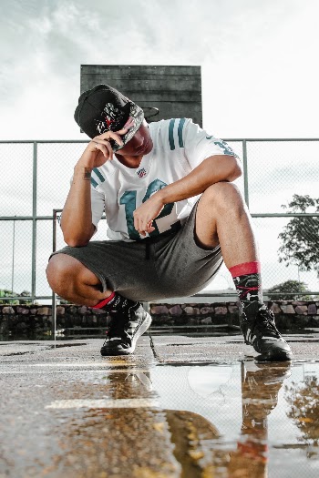 Man Sitting on the Basketball Court