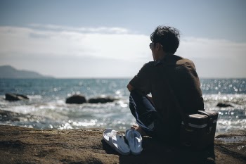 Man sitting on the beach