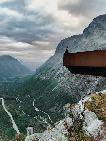 Man Sitting on the Edge on Stone