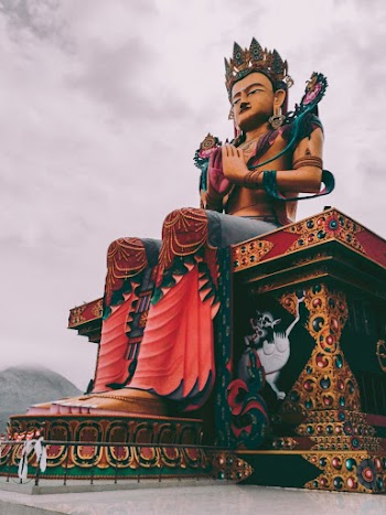 Man Sitting on Throne Statue