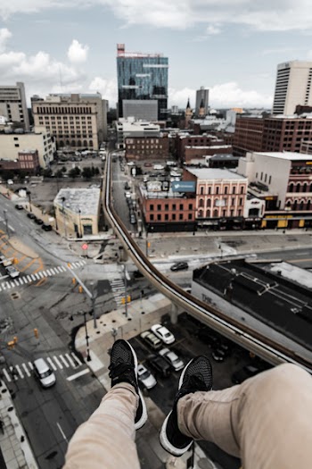 Man Sitting on Top of the Building