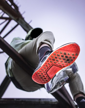 Man Sitting on Tower Base