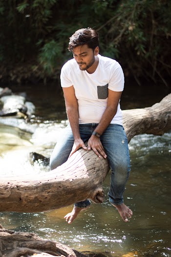 Man Sitting on Tree Branch