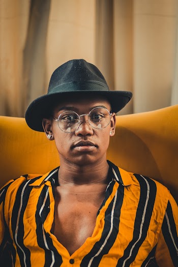 Man Sitting On Yellow Chair