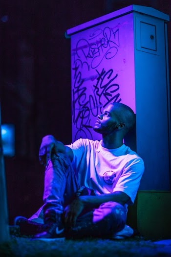 Man Sitting While Looking Up