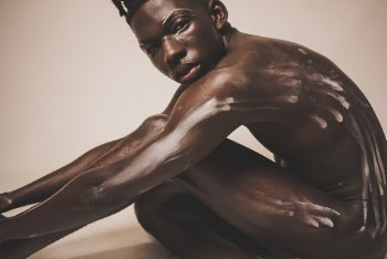 Man Sitting While Naked