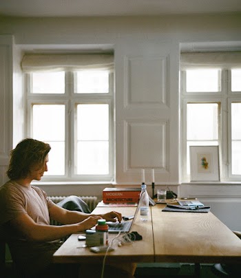 Man Sitting While Using Laptop