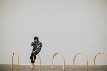 Man Sitting Yellow Arch Tunnel