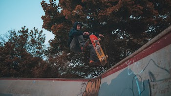 Man Skateboarding at the Rink