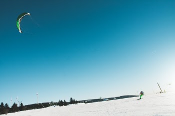 Man Skiing on Snow Covered Landscape