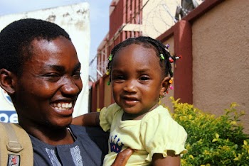 Man Smiling Holding A Girl