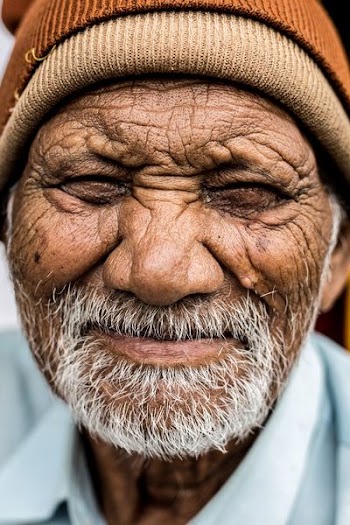 man smiling while taking photo