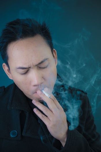 man smoking cigarette