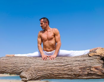 Man Splitting on Driftwood