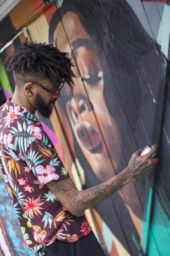 Man Spraying Woman Mural