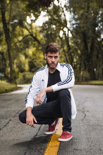 Man Squat Sitting On Road