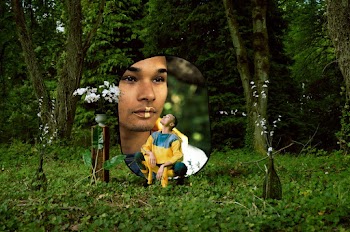 Man Squatting Near Trees