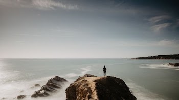man stand on top of the mountain