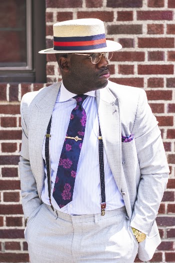 Man Standing Against Brick Wall