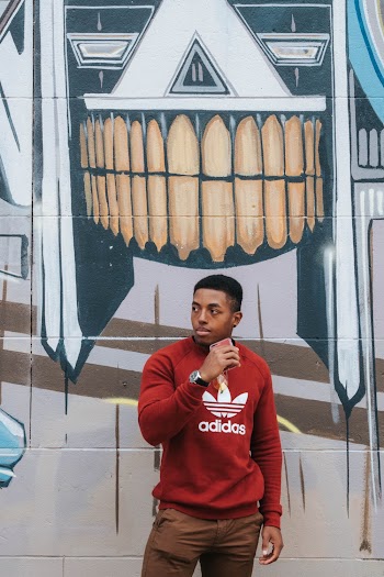 Man Standing Against Wall