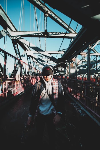 Man Standing at the Suspension Bridge