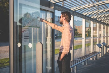 Man standing at tram stop